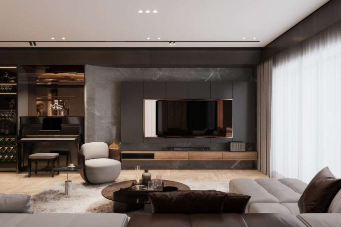 Un salon moderne aux couleurs de peinture sombres avec un mur en marbre gris, un meuble TV en bois et un canapé beige.